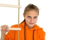 Portrait of cheerful girl playing on rope ladder Royalty Free Stock Photo