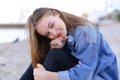 Portrait of cheerful girl who poses on camera and cute laughs si Royalty Free Stock Photo