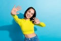 Portrait of cheerful gorgeous person toothy smile arms palms wave give high five isolated on blue color background