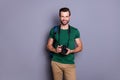 Portrait of cheerful guy ready travel abroad hold bag professional dlsr camera wear style stylish tendy clothes isolated