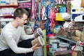 Portrait of cheerful guy selecting tasty treats Royalty Free Stock Photo