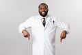 Portrait of cheerful handsome african-american male doctor inviting patients his clinic, check-up or professional Royalty Free Stock Photo