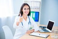 Portrait of cheerful happy female doctor showing thumbs up Royalty Free Stock Photo