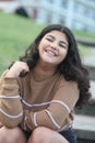 portrait of a smiling teenage girl outdoors