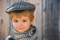 Portrait of cheerful little boy in retro cap. Cute boy. Beautiful kid.