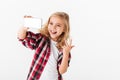 Portrait of a cheerful little girl taking a selfie
