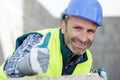 portrait cheerful male builder showing thumbs up Royalty Free Stock Photo