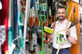 Man selecting gardening equipment in store. Royalty Free Stock Photo