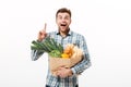 Portrait of a cheerful man holding paper bag Royalty Free Stock Photo