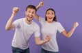 Portrait of cheerful people smiling and clenching fists Royalty Free Stock Photo
