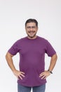 Portrait of a cheerful middle-aged man confidently smiling with hands on hips, isolated on a white backdrop Royalty Free Stock Photo