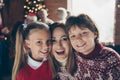 Portrait of cheerful mom with siblings. Noel morning gathering.