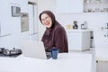 Cheerful old woman laughing in kitchen Royalty Free Stock Photo