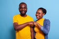 Portrait of cheerful people bumping fists together on camera