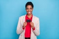 Portrait of cheerful person demonstrate plastic debit card isolated on blue color background