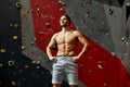 Portrait of cheerful rock climber in indoor climbing gym Royalty Free Stock Photo