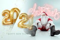 Portrait of a cheerful Santa Claus in a red suit on a light background with the gold numbers 2021.mixed media. Concept for Royalty Free Stock Photo