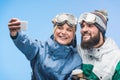 Snowboarders taking selfie