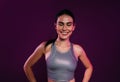 Portrait of a cheerful sportswoman.in silver fitness wear