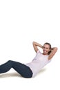 Portrait of cheerful sporty woman doing sit ups Royalty Free Stock Photo