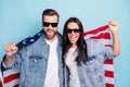 Portrait of cheerful spouses in eyewear eyeglasses scream yeah yes hold american flag wear denim jeans jackets Royalty Free Stock Photo