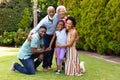 Portrait of cheerful three generational african american family at the backyard garden