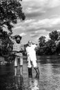 Portrait of cheerful two bearded men fishing. Hobby for soul. Retirement fishery. Friends fishing. Successful fly Royalty Free Stock Photo