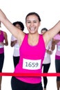 Portrait of cheerful winner athlete crossing finish line Royalty Free Stock Photo