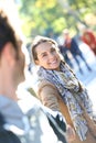 Portrait of cheerful woman pulling her boyfriend