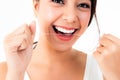 Cheerful woman smiling Use clean dental floss to maintain healthy, white teeth. Royalty Free Stock Photo