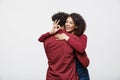 Portrait of a cheerful young african couple standing together and showing ok gesture isolated over white background Royalty Free Stock Photo