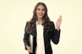 Portrait of a cheerful young casual girl standing isolated over gray background, using laptop computer. Business woman Royalty Free Stock Photo