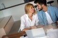 Portrait of a cheerful young couple calculating their bills Royalty Free Stock Photo