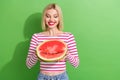 Portrait of cheerful young cute pretty cool youngster lady white teeth want bite huge watermelon isolated on green color