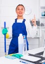 Female cleaner with duster Royalty Free Stock Photo