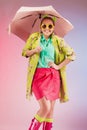 Portrait of a cheerful young girl in bright casual clothes smiling at the camera with beautiful smile. Colorful background Royalty Free Stock Photo