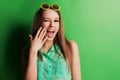 Portrait of a cheerful young girl in bright casual clothes smiling at the camera with beautiful smile. Colorful background Royalty Free Stock Photo