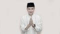 Portrait of cheerful young muslim man smiling in front of camera