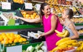 woman with child buying fruits Royalty Free Stock Photo