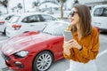 Woman with phone at the car parking Royalty Free Stock Photo