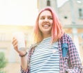 .Portrait of cheerfully smiling beautiful young female modern teenager with extraordinary hairstyle color in checkered shirt