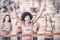 Cheering young woman winning breast cancer marathon Royalty Free Stock Photo