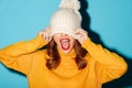 Portrait of a cheery young girl dressed in winter hat Royalty Free Stock Photo