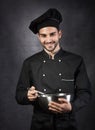Portrait of a chef cooker in black uniform. Royalty Free Stock Photo