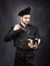 Portrait of a chef cooker in black uniform. Royalty Free Stock Photo