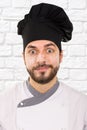 Portrait of chef with flour on face