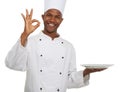 Portrait, chef and ok sign with plate presentation in studio isolated on white background. Smile, cooking or okay hand