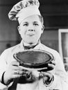 Portrait of chef with pie Royalty Free Stock Photo