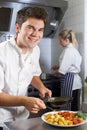Portrait Of Chef Working In Restaurant Kitchen Royalty Free Stock Photo