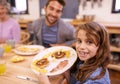 Portrait, child and breakfast in kitchen in home with family, eating and bonding together at table. Food, pancakes and Royalty Free Stock Photo